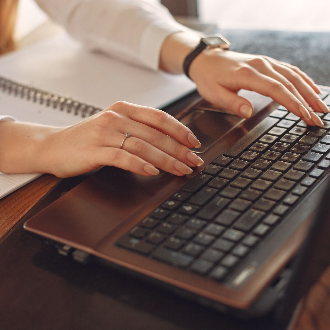 A developer doing a typing on a keyboard